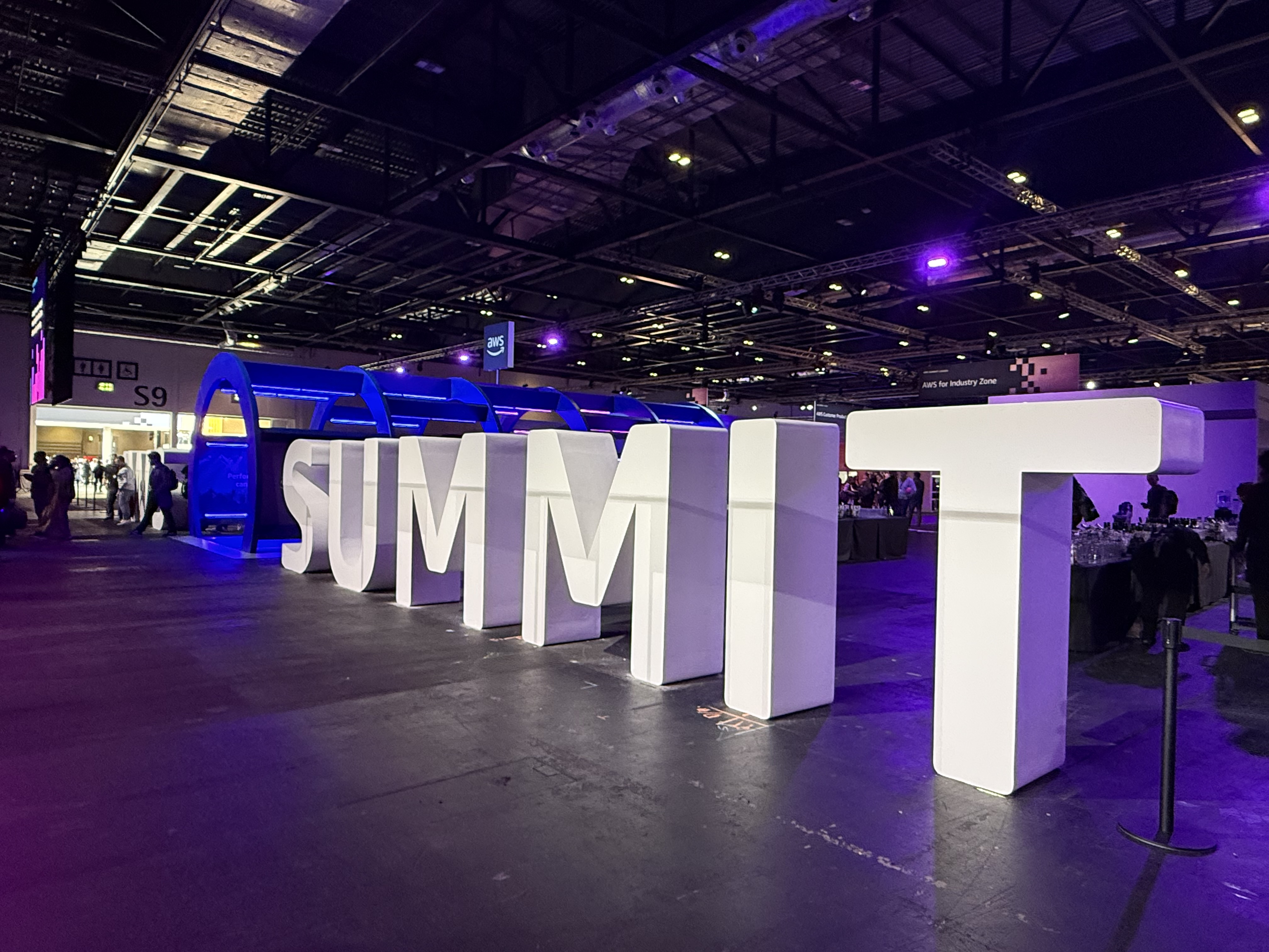 The large "SUMMIT" letters lit up on the ExCeL floor