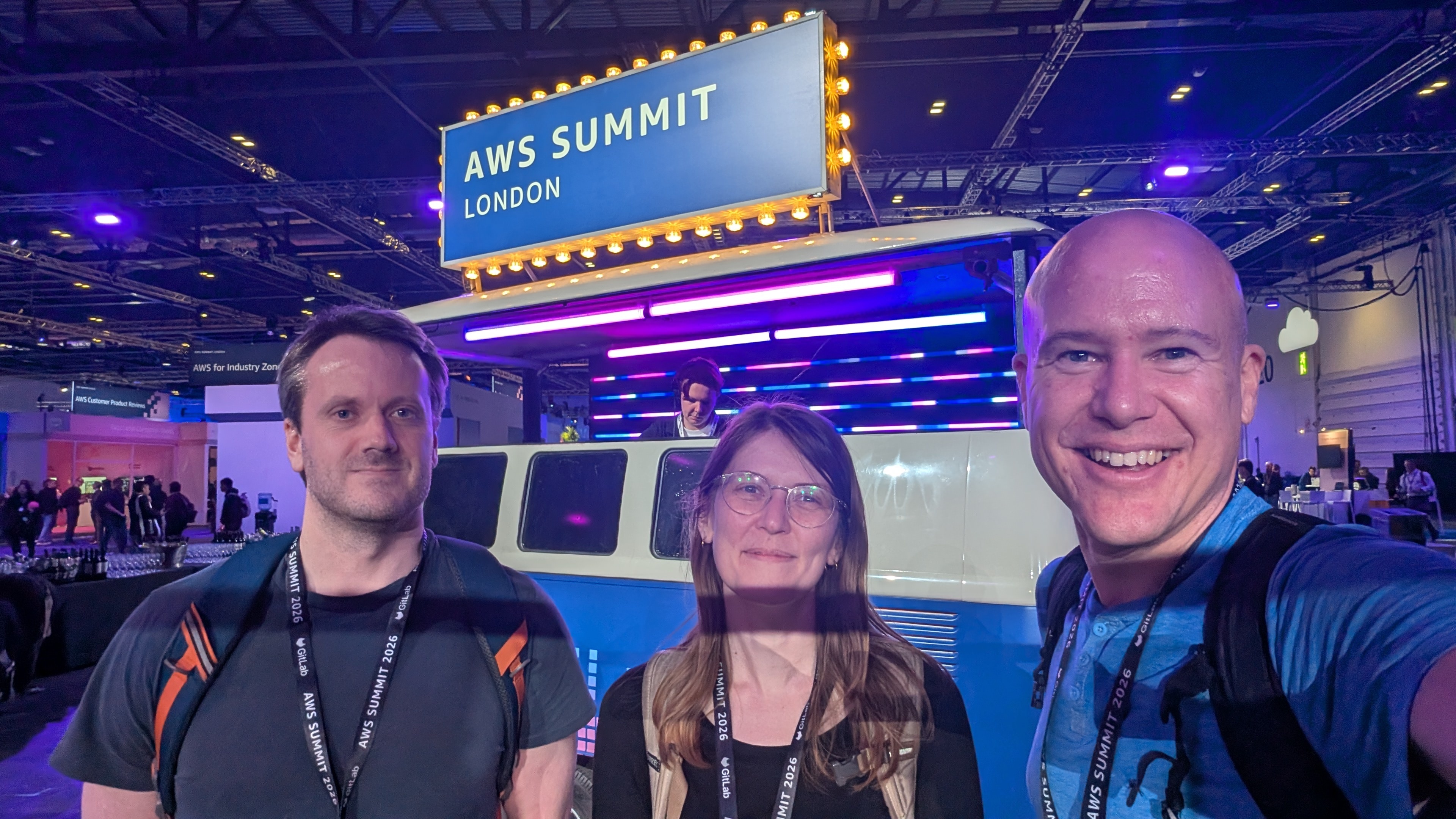 Robert Dexter, Sarah and Robert Mackenzie in front of the AWS Summit London sign